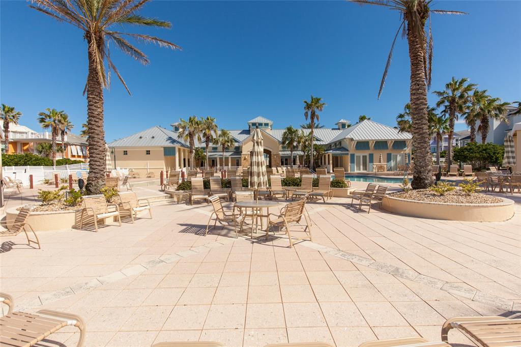 6 Cinnamon Beach Way Palm Coast, FL 32137 - Photo 41 of 58 a view of a swimming pool with outdoor seating