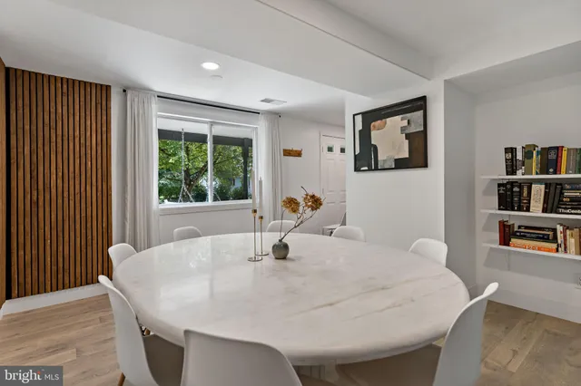 a dining room with table and chairs
