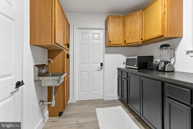 a kitchen with stainless steel appliances granite countertop a refrigerator and cabinets