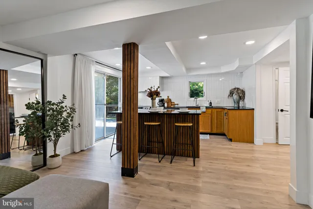 a view of a living room and kitchen