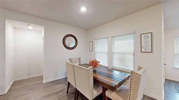 a view of a room with furniture wooden floor and window
