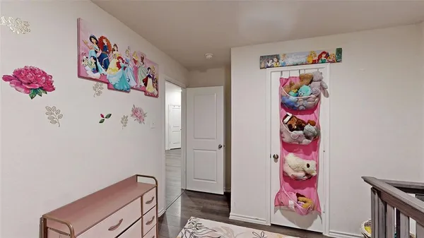 a room with a bed and a tv