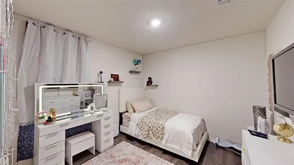 a bedroom with a bed and a cabinets