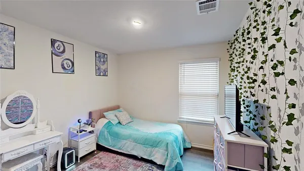 a bed room with a bed and a couch