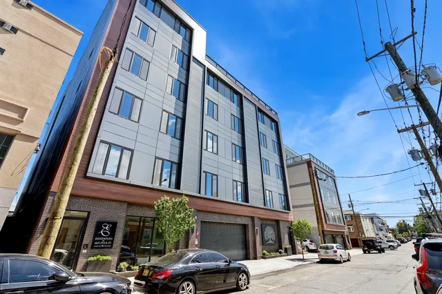 a front view of a building with a potted plant