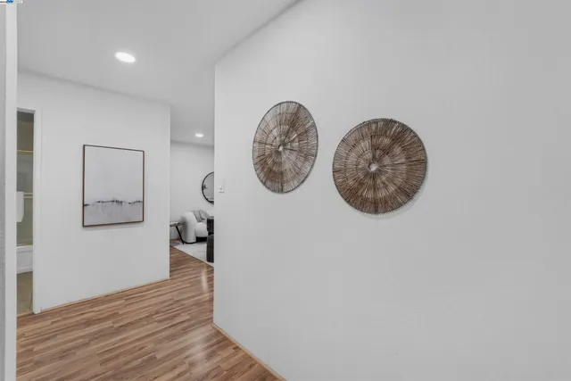 a bedroom with a bed and a lamp