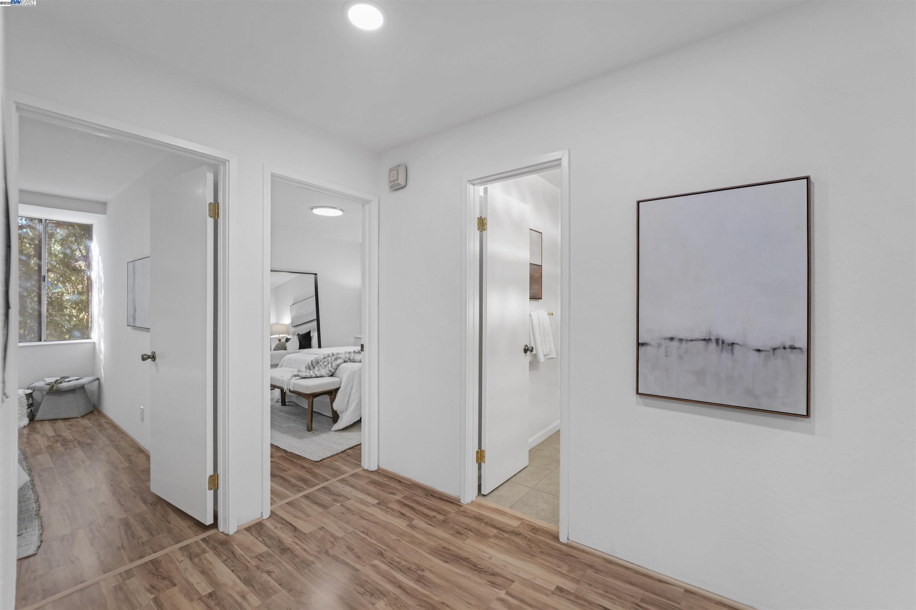 505 Cypress Point Drive, Unit 140 Mountain View, CA 94043 - Photo 14 of 60 a view of a room with wooden floor and a bathroom