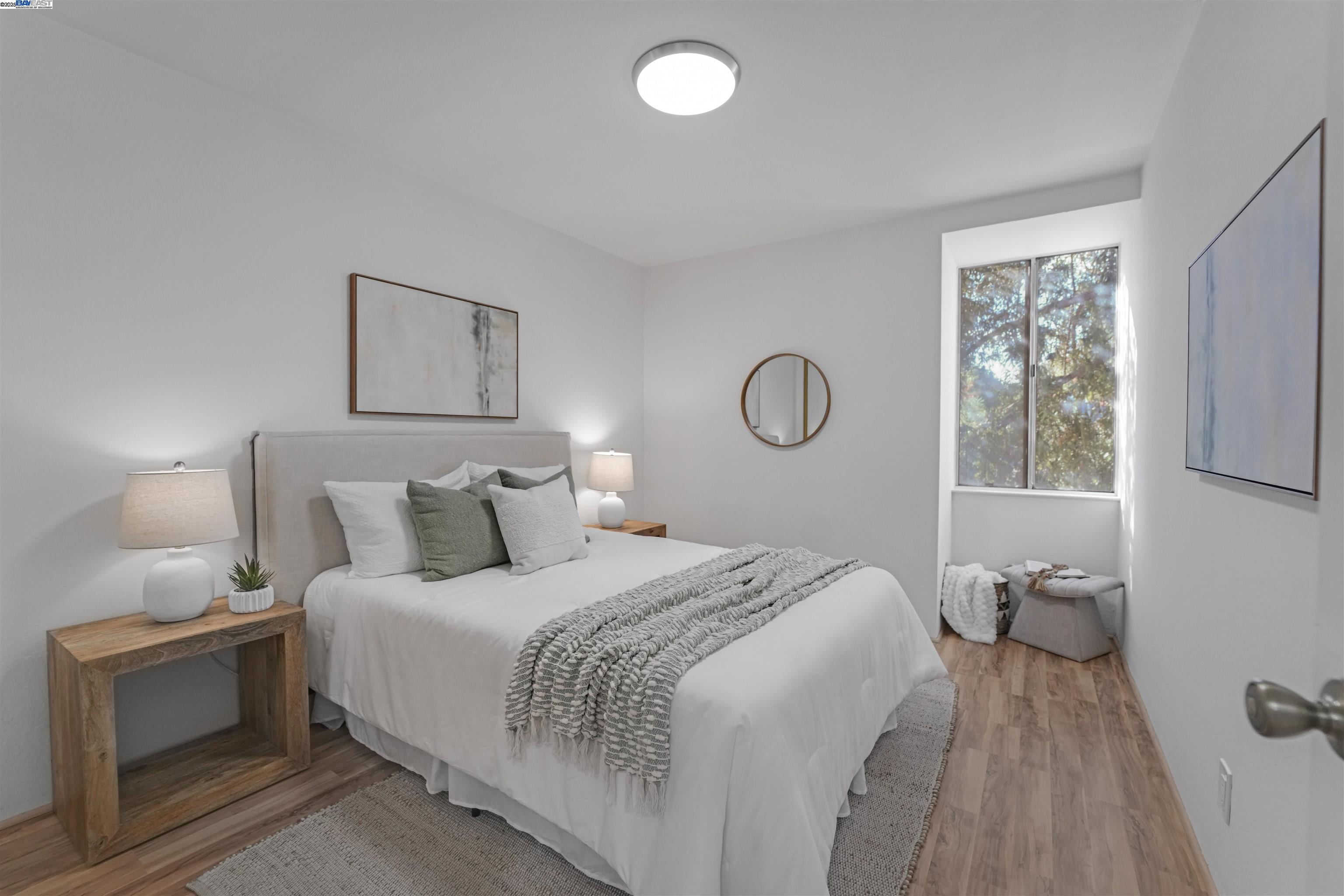 505 Cypress Point Drive, Unit 140 Mountain View, CA 94043 - Photo 16 of 60 a bedroom with a bed and a window