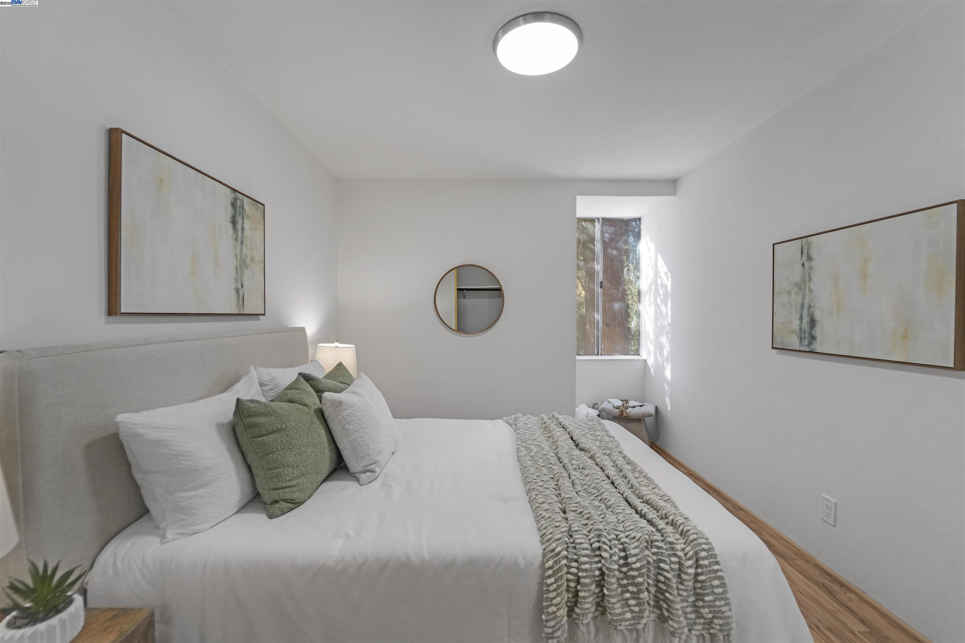505 Cypress Point Drive, Unit 140 Mountain View, CA 94043 - Photo 17 of 60 a bedroom with a bed and window