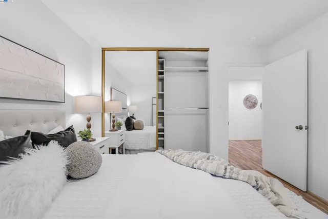 a bathroom with a shower sink vanity mirror and toilet