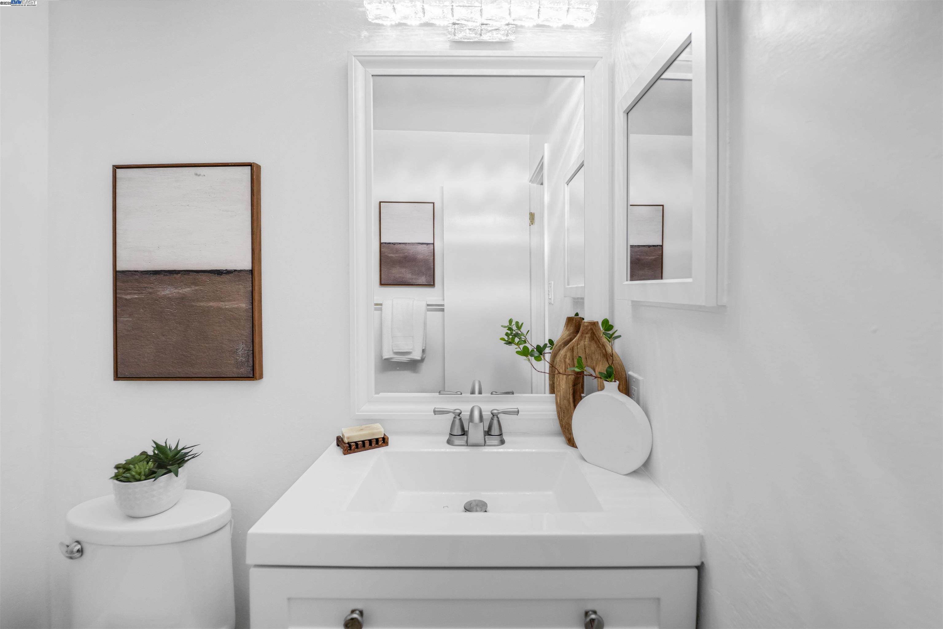 505 Cypress Point Drive, Unit 140 Mountain View, CA 94043 - Photo 26 of 60 a bathroom with a sink and a mirror