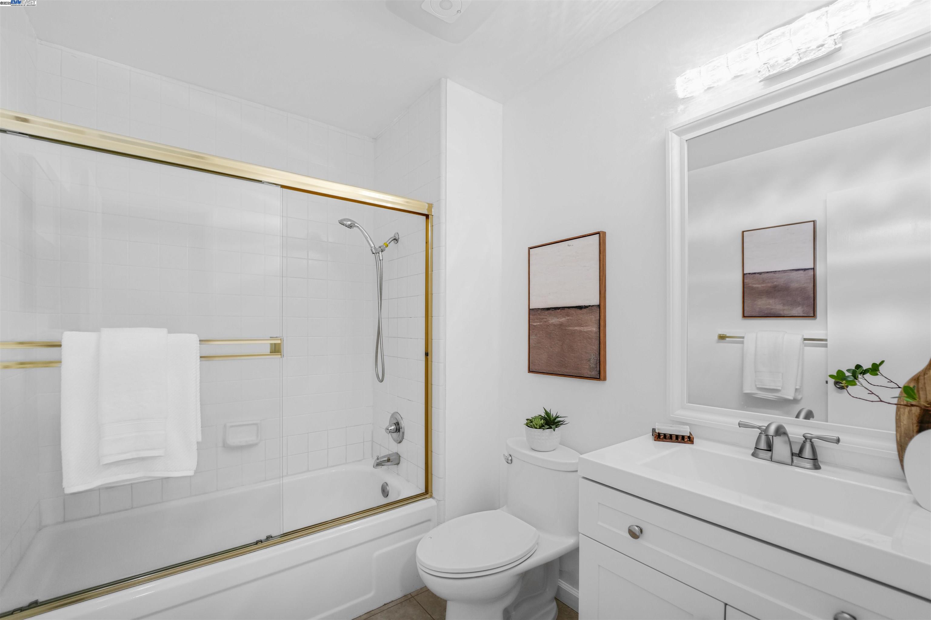 505 Cypress Point Drive, Unit 140 Mountain View, CA 94043 - Photo 27 of 60 a bathroom with a sink a toilet and a mirror