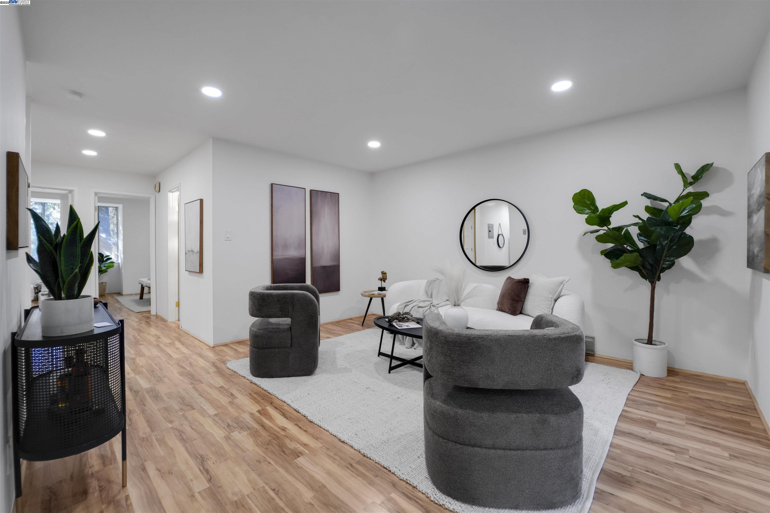 505 Cypress Point Drive, Unit 140 Mountain View, CA 94043 - Photo 31 of 60 a living room with furniture a clock and a flat screen tv
