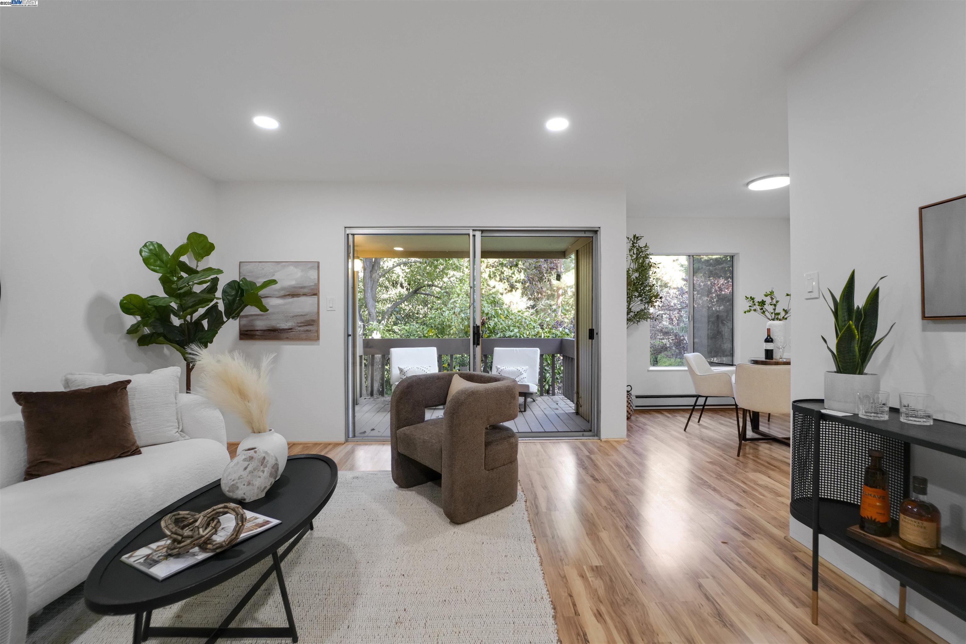 505 Cypress Point Drive, Unit 140 Mountain View, CA 94043 - Photo 35 of 60 a living room with furniture and a potted plant