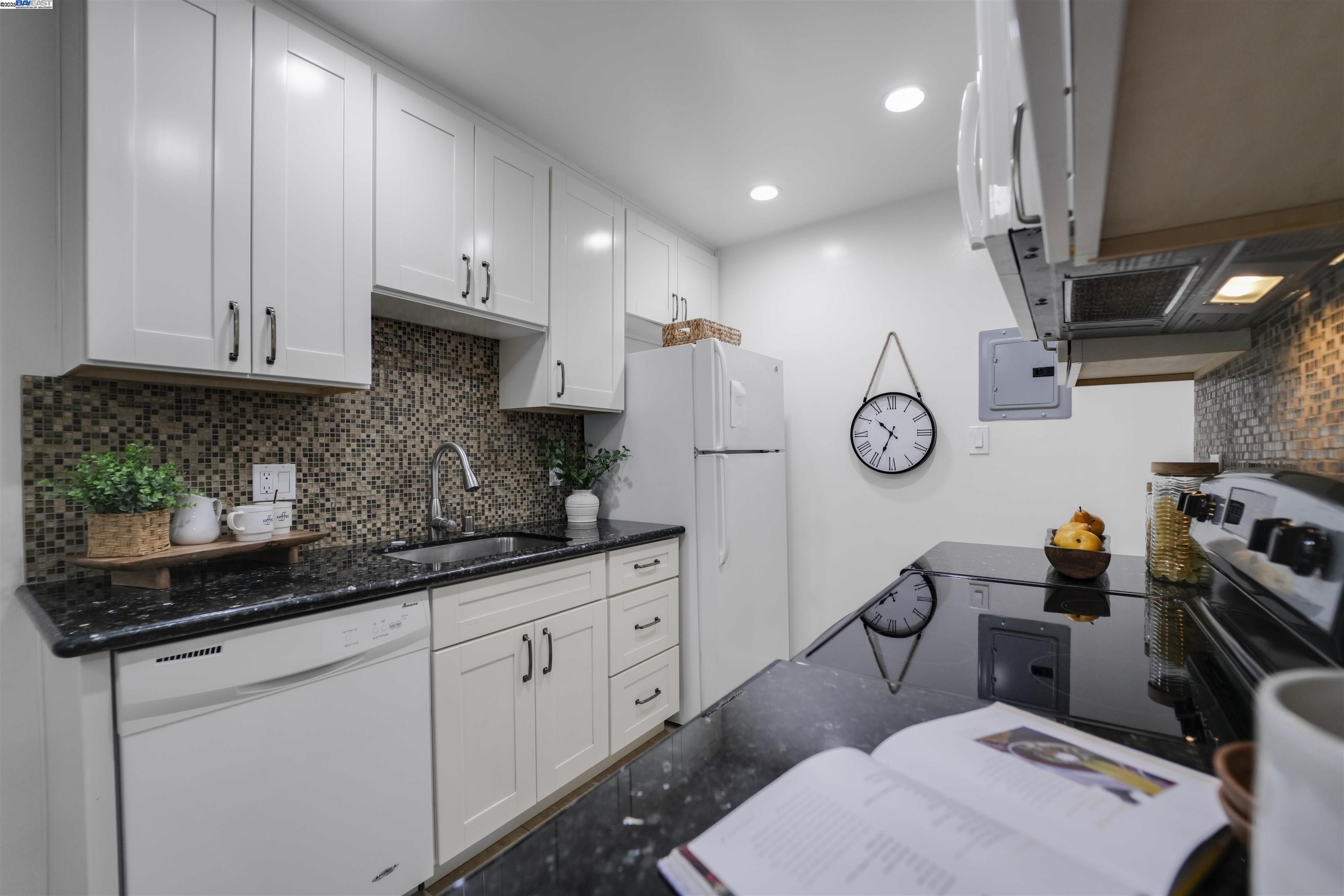 505 Cypress Point Drive, Unit 140 Mountain View, CA 94043 - Photo 40 of 60 a kitchen with cabinets appliances and a window