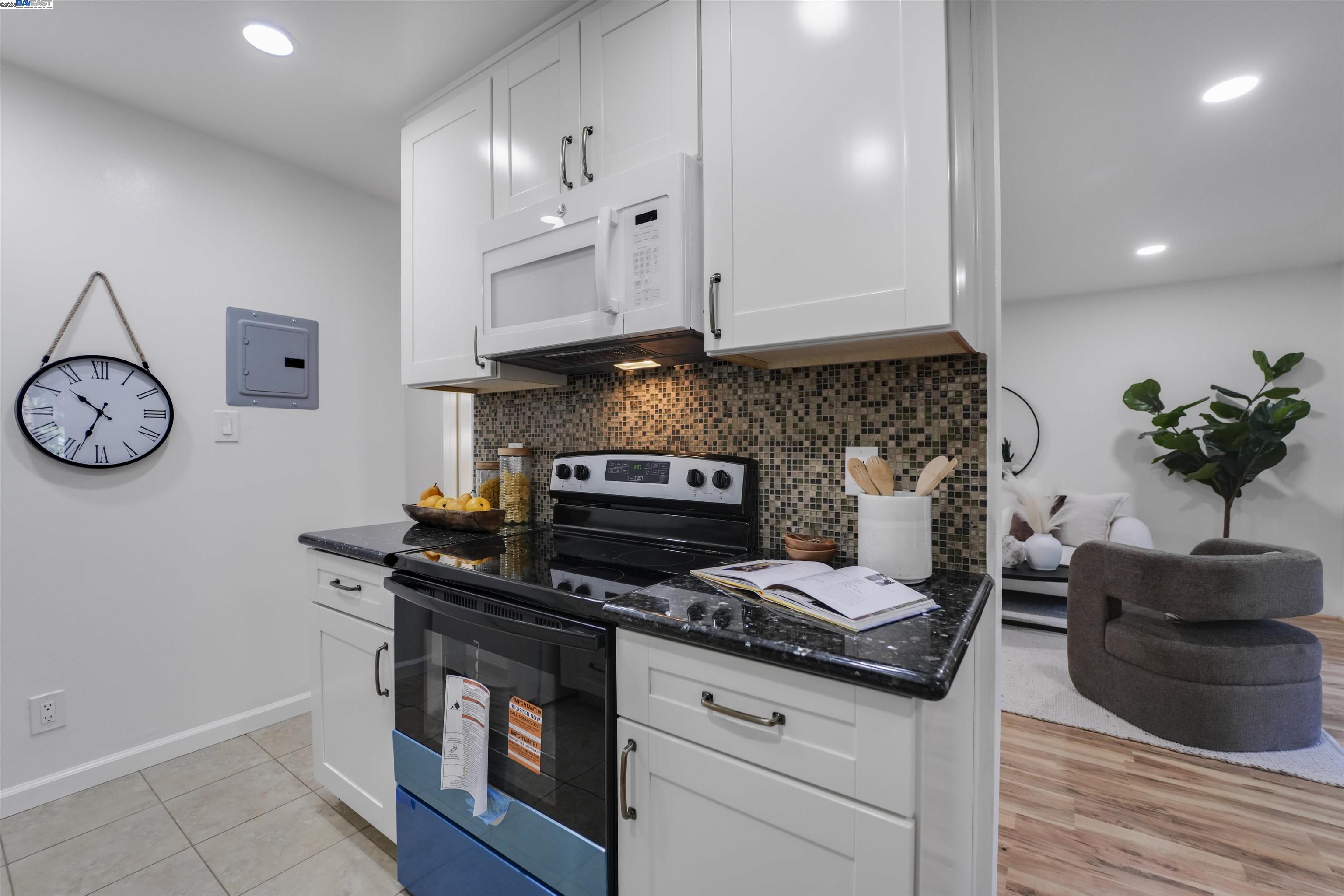 505 Cypress Point Drive, Unit 140 Mountain View, CA 94043 - Photo 41 of 60 a kitchen with stainless steel appliances granite countertop a stove a sink and a microwave