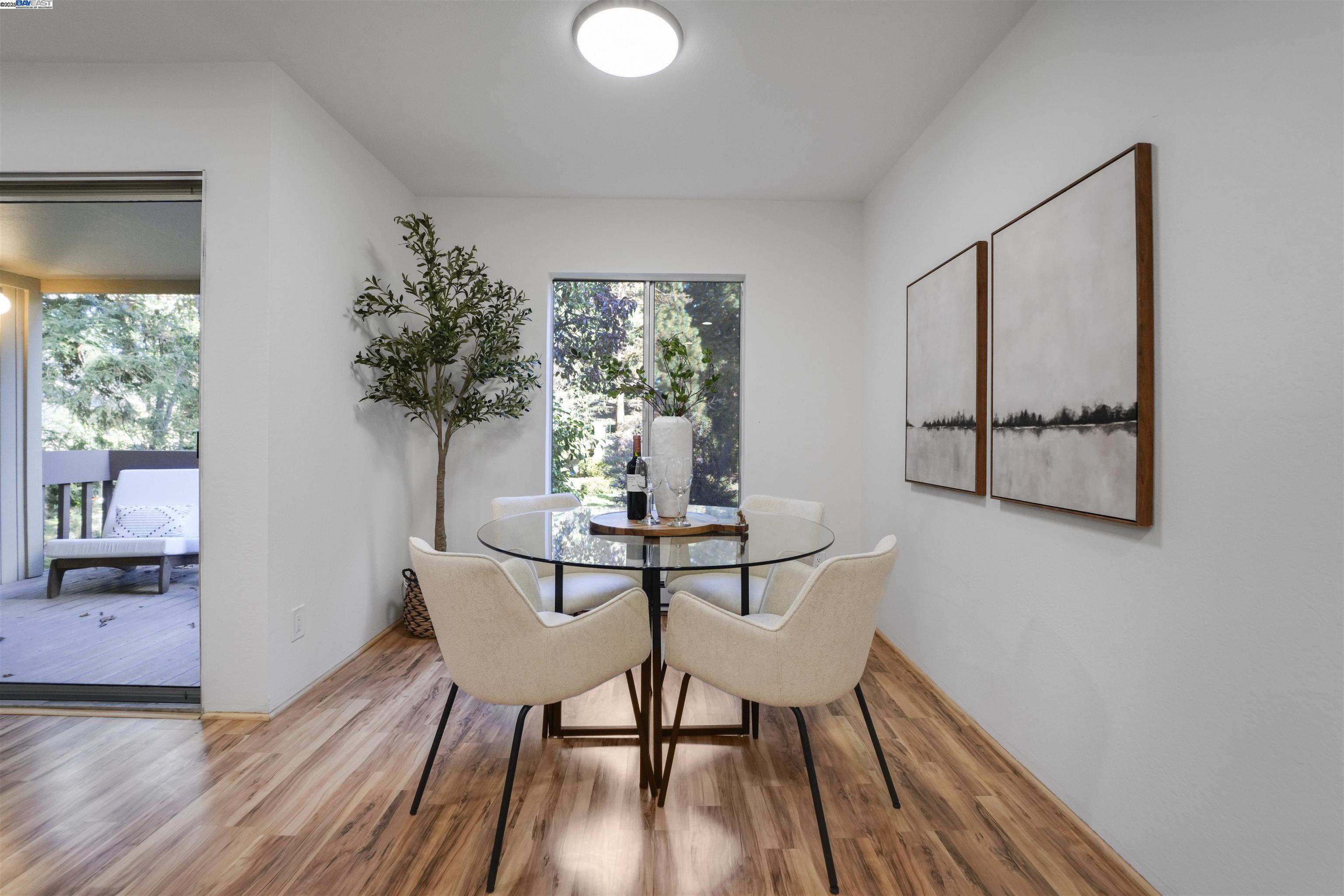 505 Cypress Point Drive, Unit 140 Mountain View, CA 94043 - Photo 42 of 60 a dining room with furniture and wooden floor