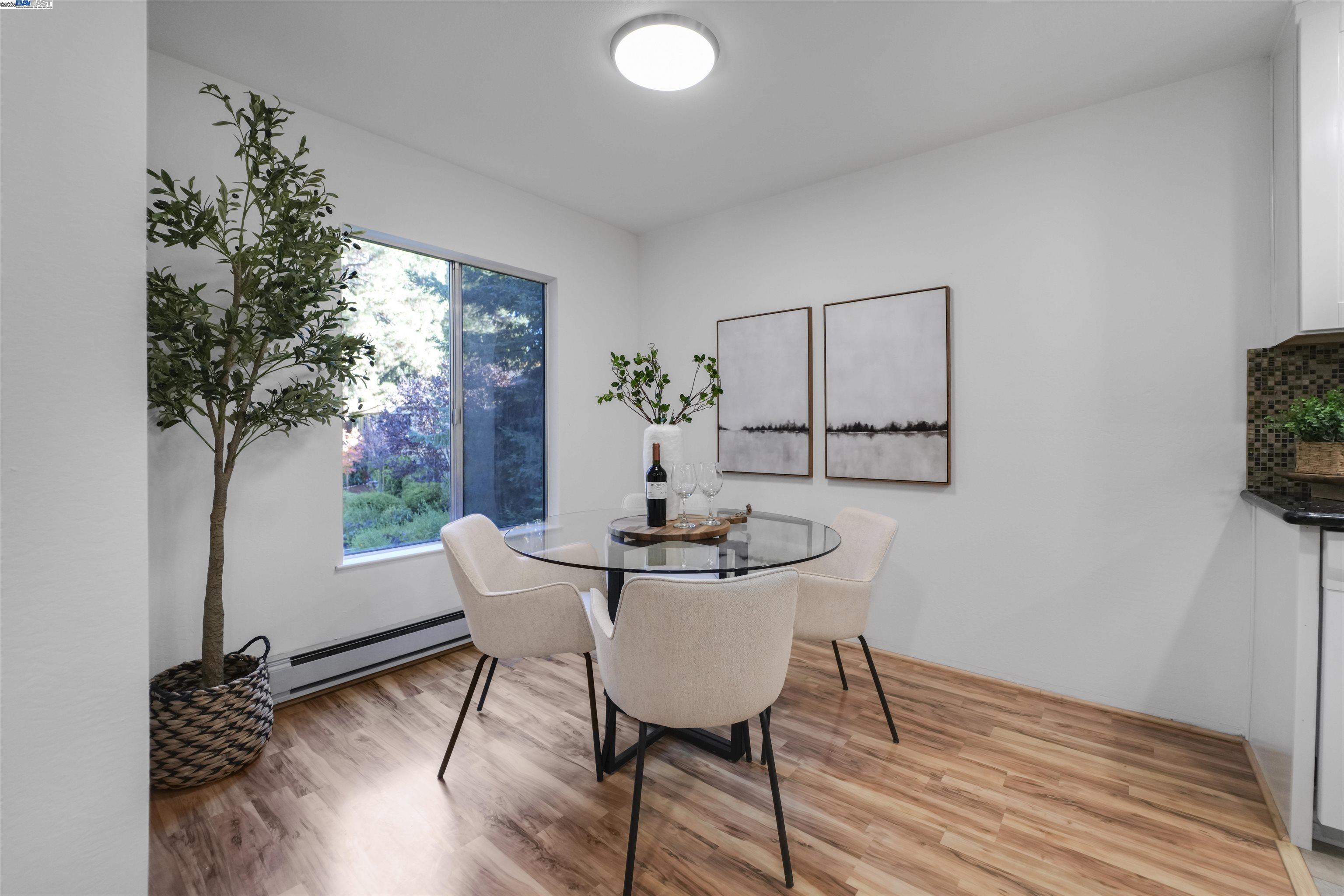 505 Cypress Point Drive, Unit 140 Mountain View, CA 94043 - Photo 43 of 60 a view of a dining room with furniture and wooden floor