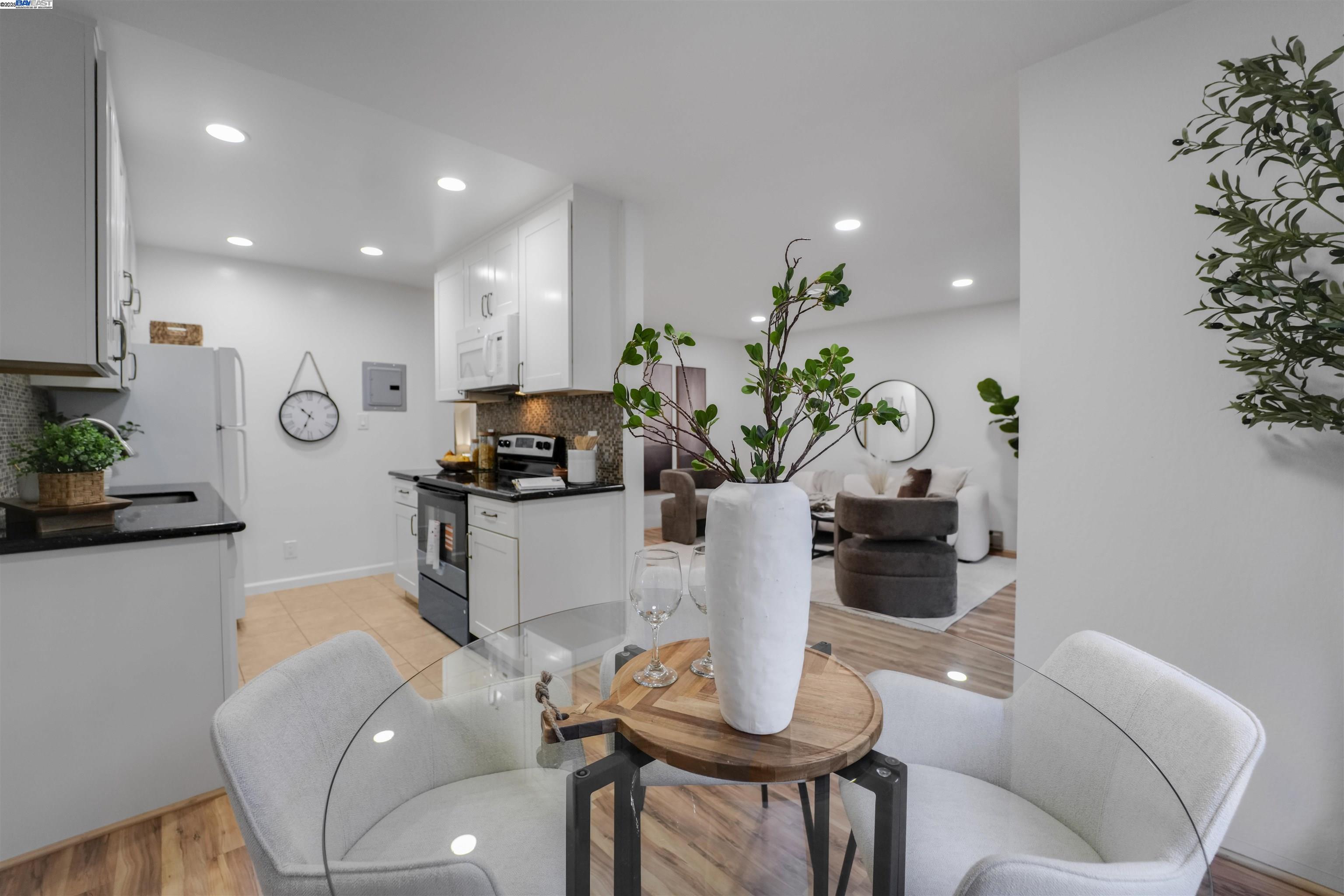 505 Cypress Point Drive, Unit 140 Mountain View, CA 94043 - Photo 44 of 60 a living room with furniture a potted plant and a table