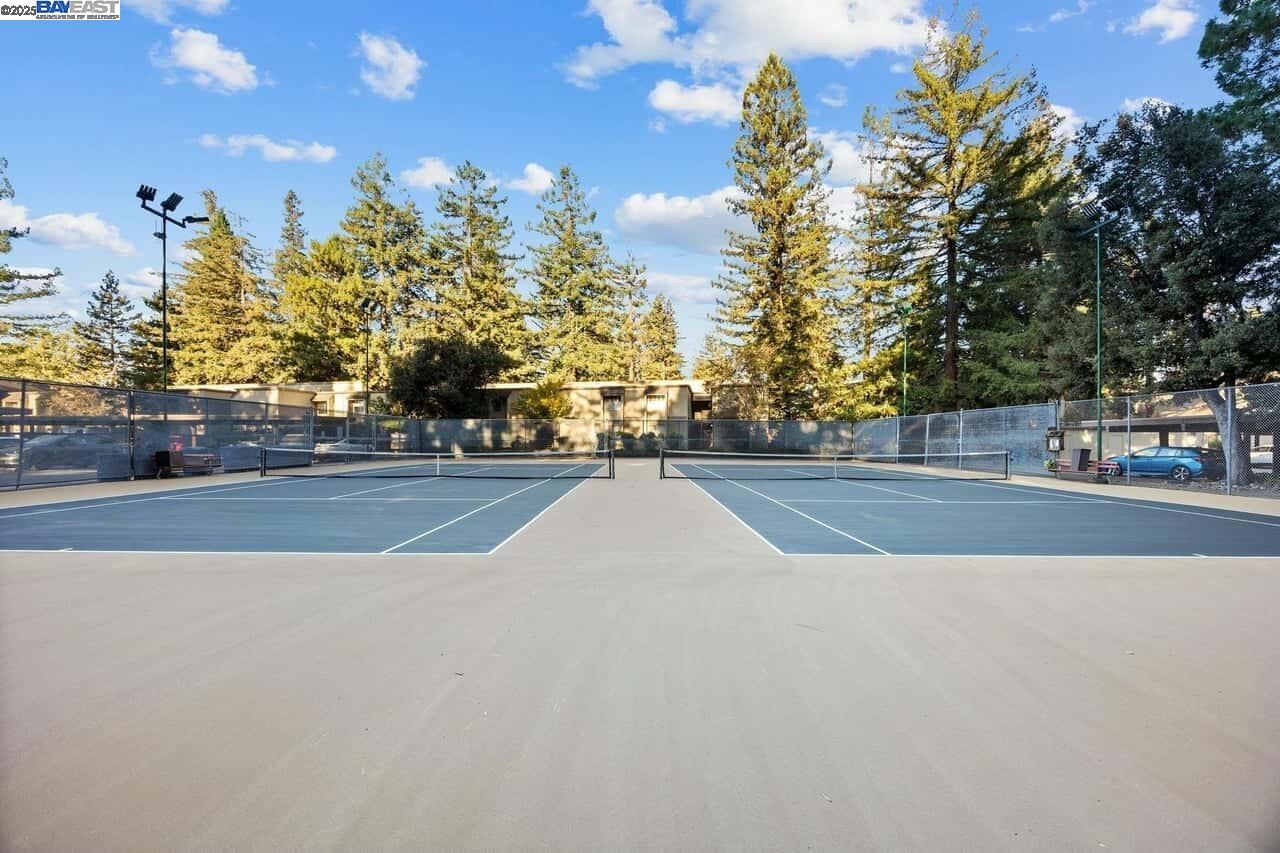 505 Cypress Point Drive, Unit 140 Mountain View, CA 94043 - Photo 58 of 60 a view of a swimming pool with an outdoor space and seating area