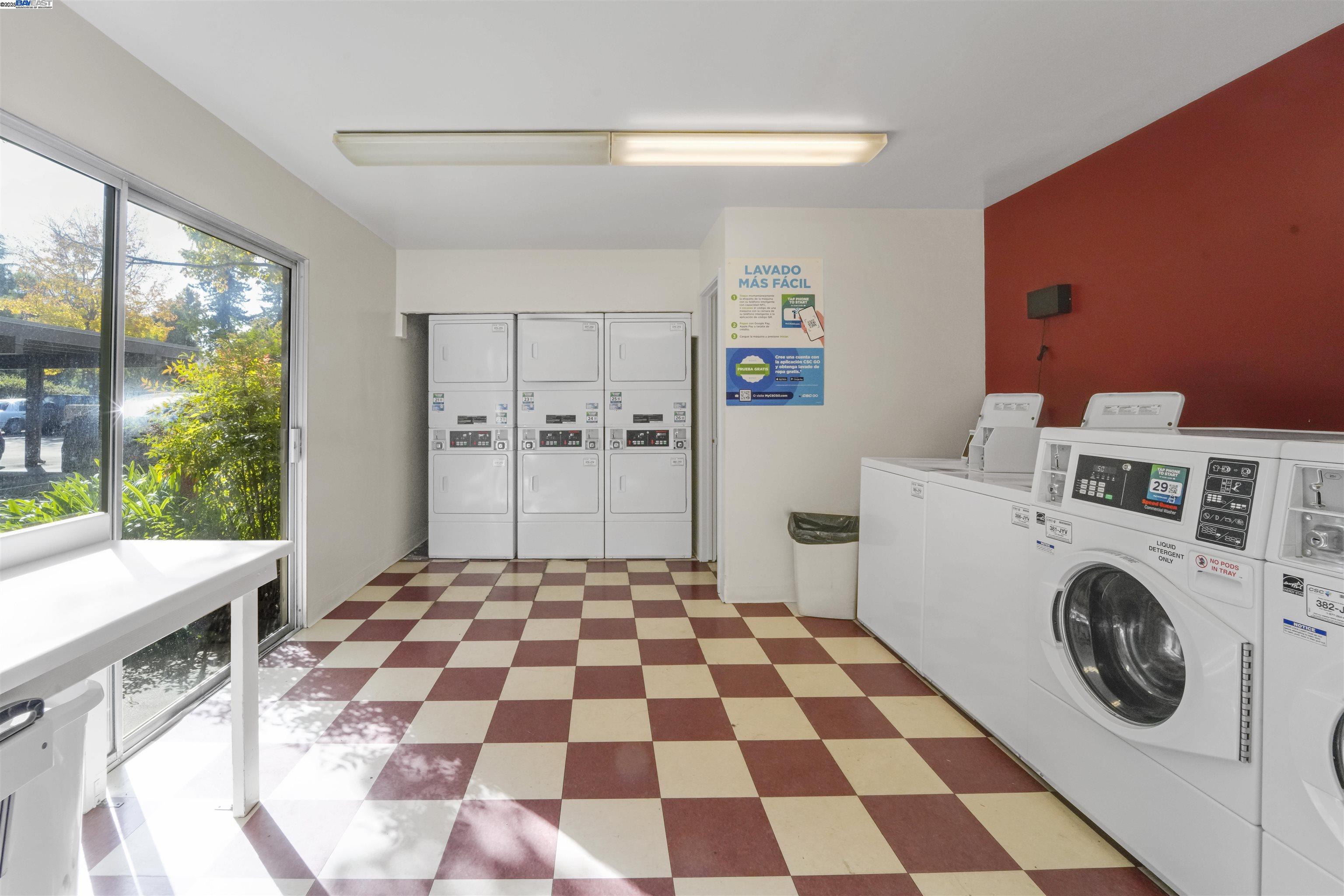 505 Cypress Point Drive, Unit 140 Mountain View, CA 94043 - Photo 59 of 60 a view of a kitchen with a washer and dryer
