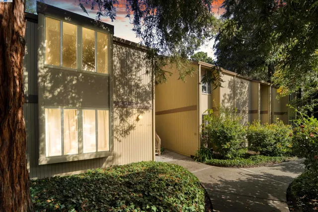 an aerial view of a residential apartment building and a street sign