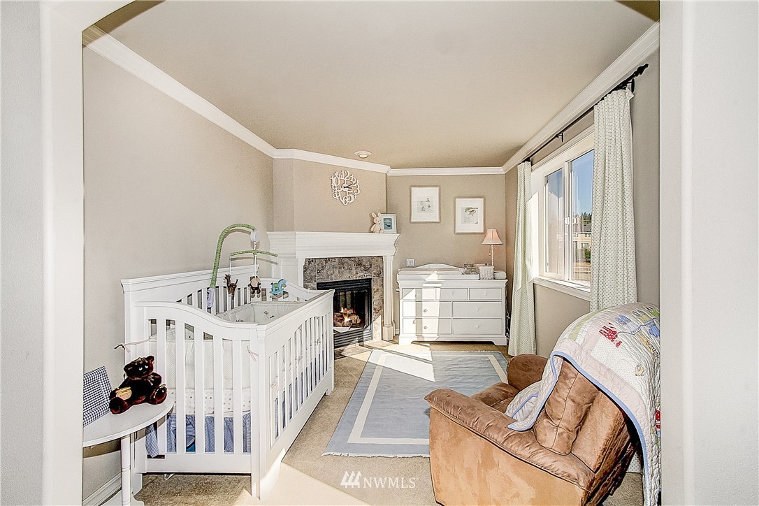 4004 215th Street Southeast Bothell, WA 98021 - Photo 14 of 25 a living room with furniture and a fireplace