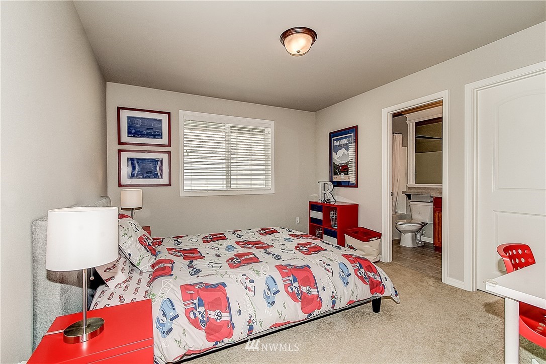 4004 215th Street Southeast Bothell, WA 98021 - Photo 17 of 25 a bedroom with a bed and wooden floor