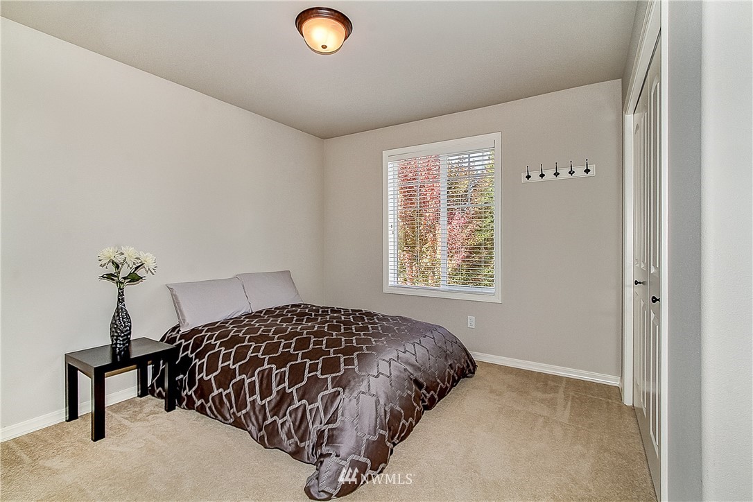 4004 215th Street Southeast Bothell, WA 98021 - Photo 18 of 25 a bedroom with a bed and a window
