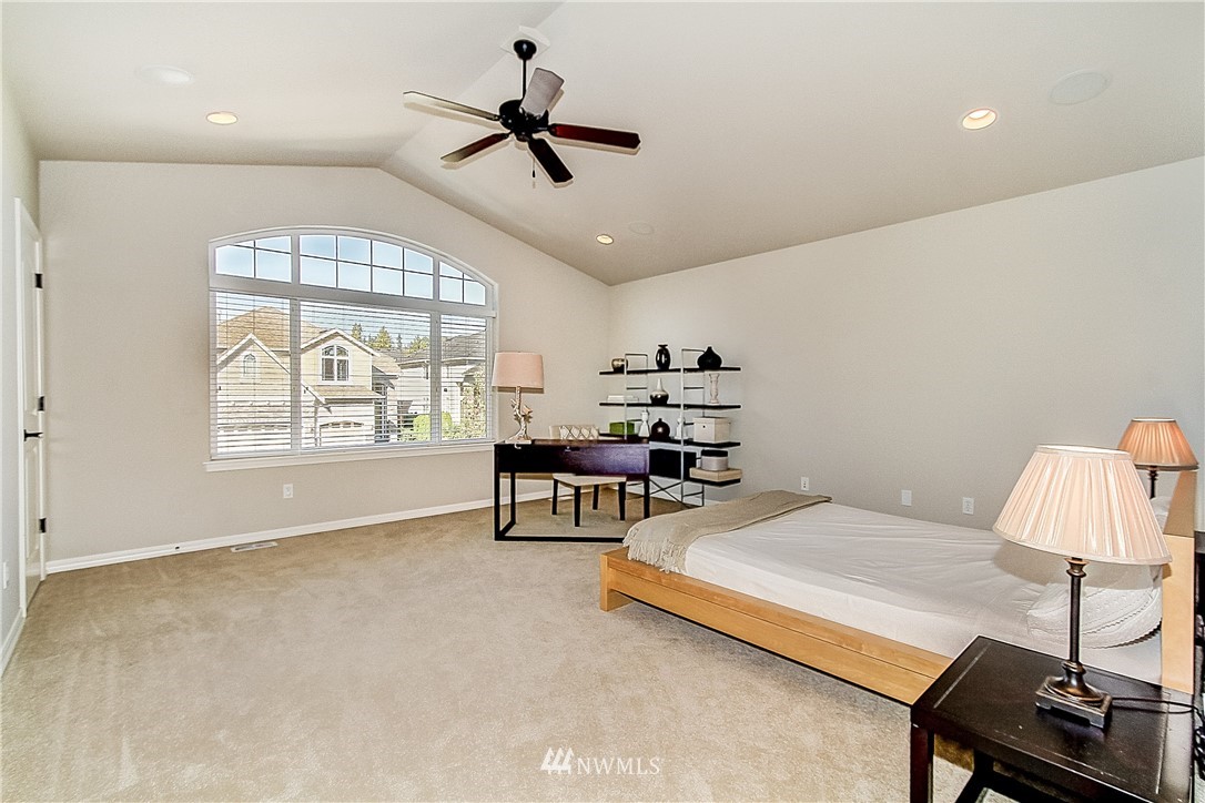 4004 215th Street Southeast Bothell, WA 98021 - Photo 21 of 25 a living room with furniture and a window