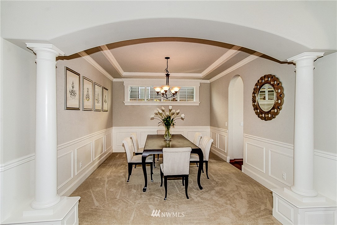 4004 215th Street Southeast Bothell, WA 98021 - Photo 5 of 25 a dining room with furniture and a chandelier
