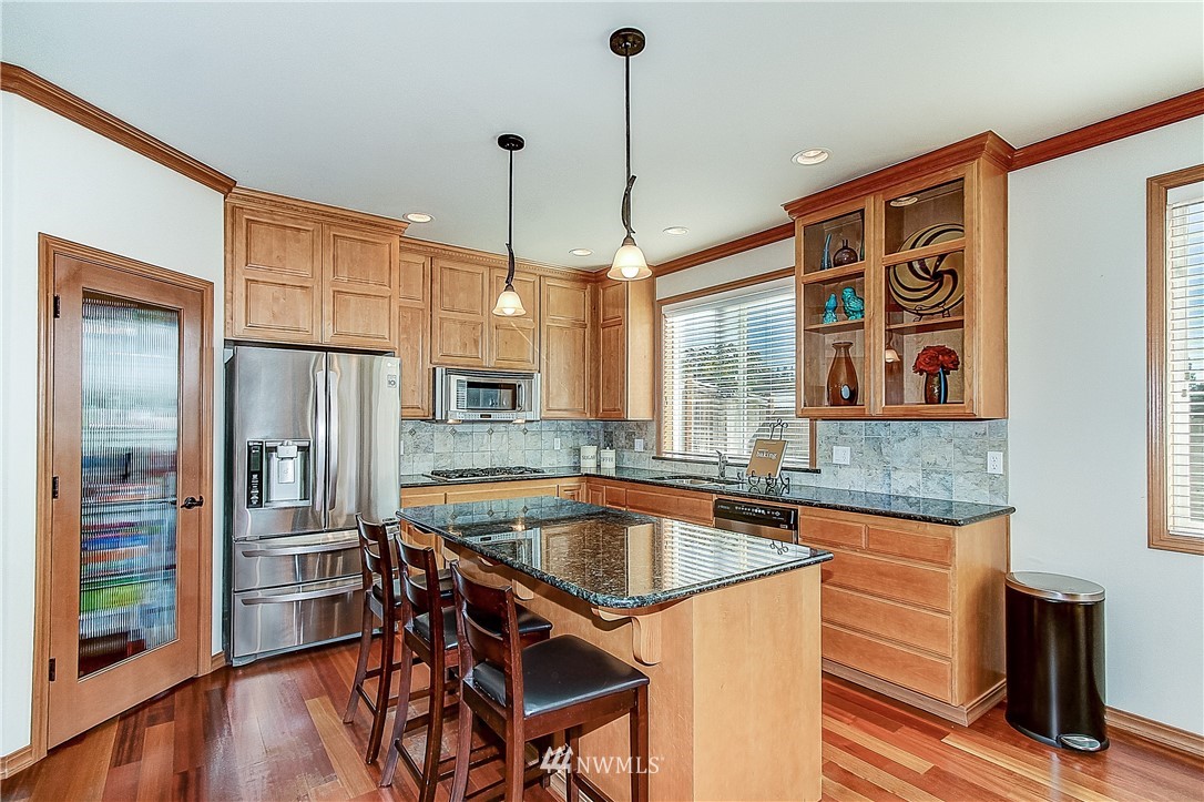 4004 215th Street Southeast Bothell, WA 98021 - Photo 6 of 25 a kitchen that has a lot of cabinets in it