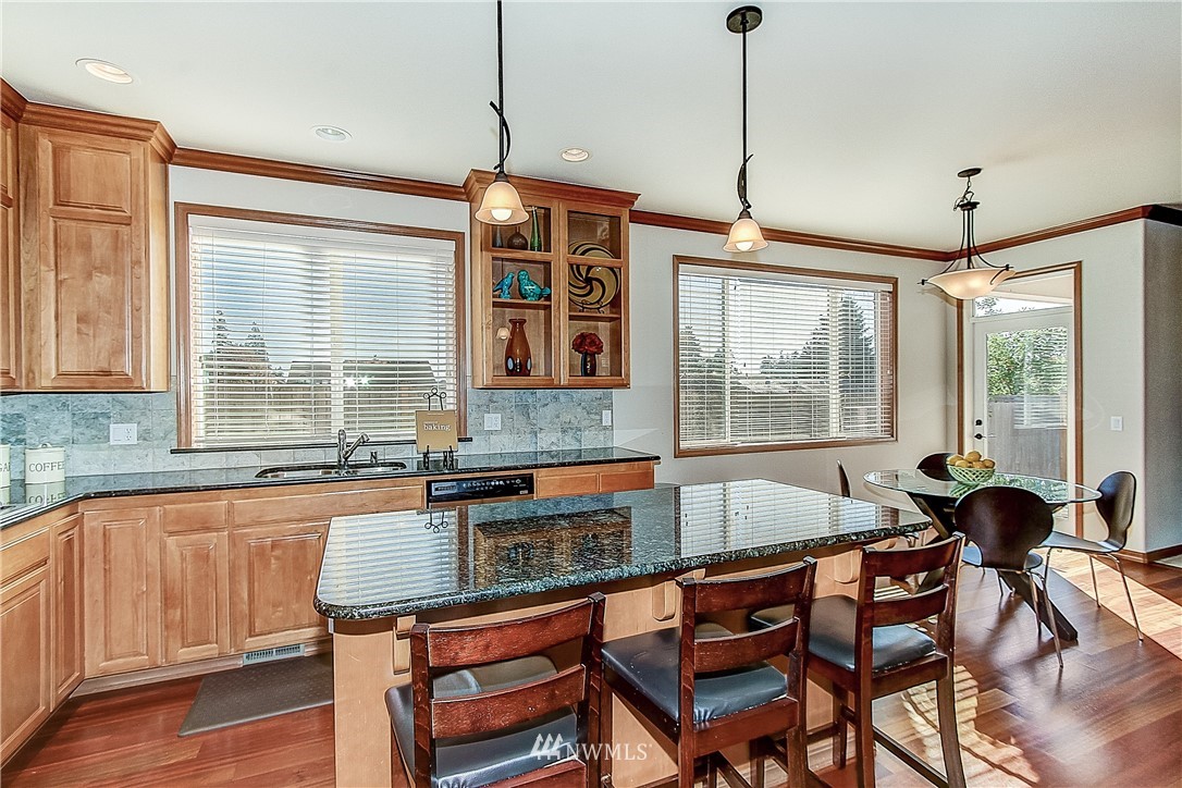 4004 215th Street Southeast Bothell, WA 98021 - Photo 7 of 25 a kitchen that has a sink and chair