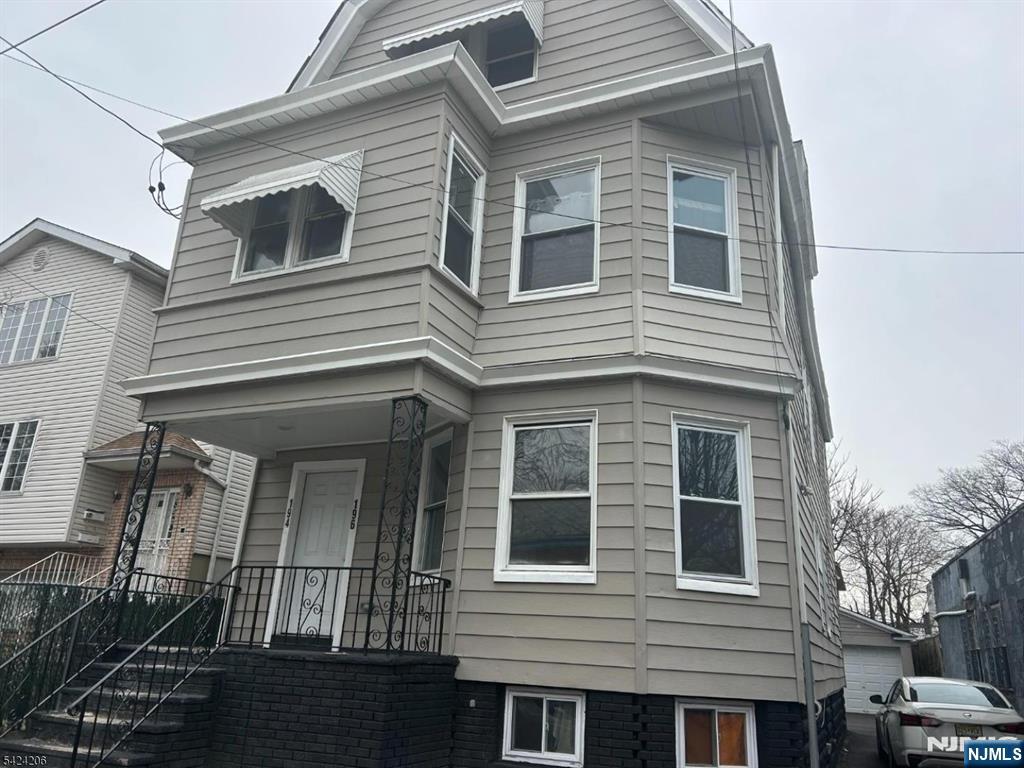 194-196 Wainwright Street Newark, NJ 07112 - Photo 1 of 6 a front view of a house