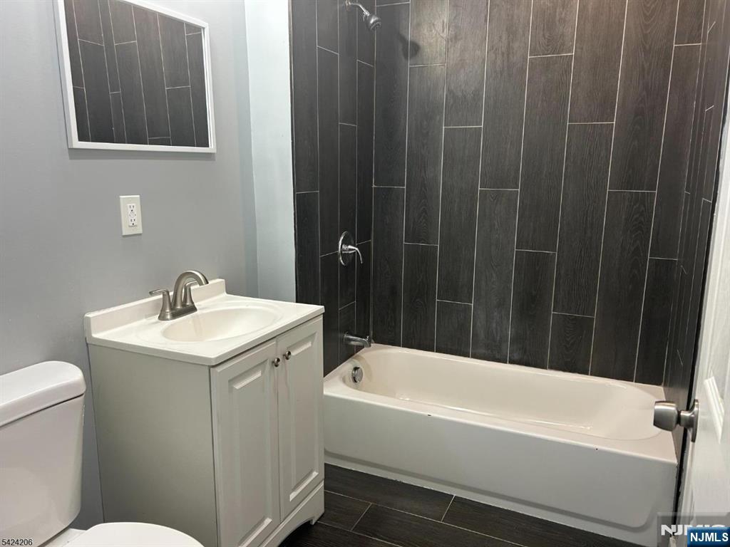 194-196 Wainwright Street Newark, NJ 07112 - Photo 3 of 6 a bathroom with a sink and toilet