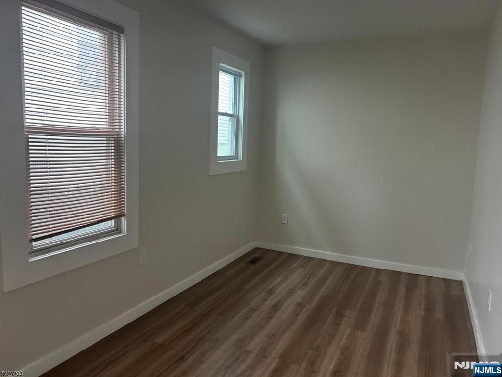 194-196 Wainwright Street Newark, NJ 07112 - Photo 5 of 6 a view of a room that has a window in it
