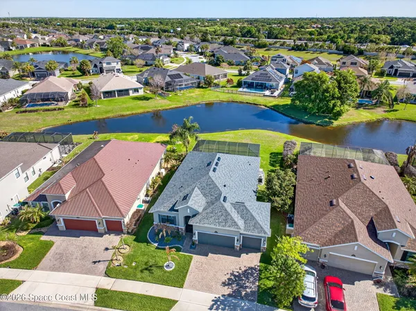 a kitchen with a refrigerator and a stove top oven