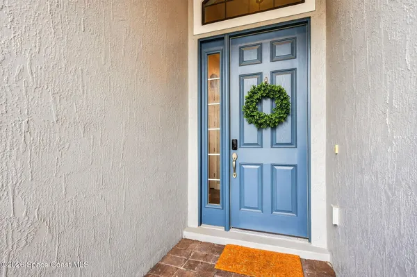a large white kitchen with stainless steel appliances granite countertop a stove top oven a sink and dishwasher