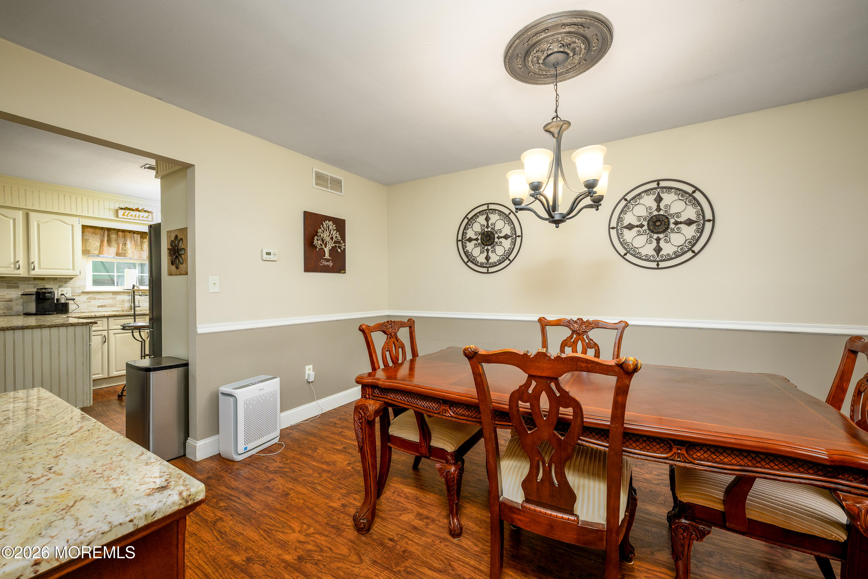 4 Cambridge Drive Howell, NJ 07731 - Photo 11 of 39 a view of a dining room with furniture and wooden floor