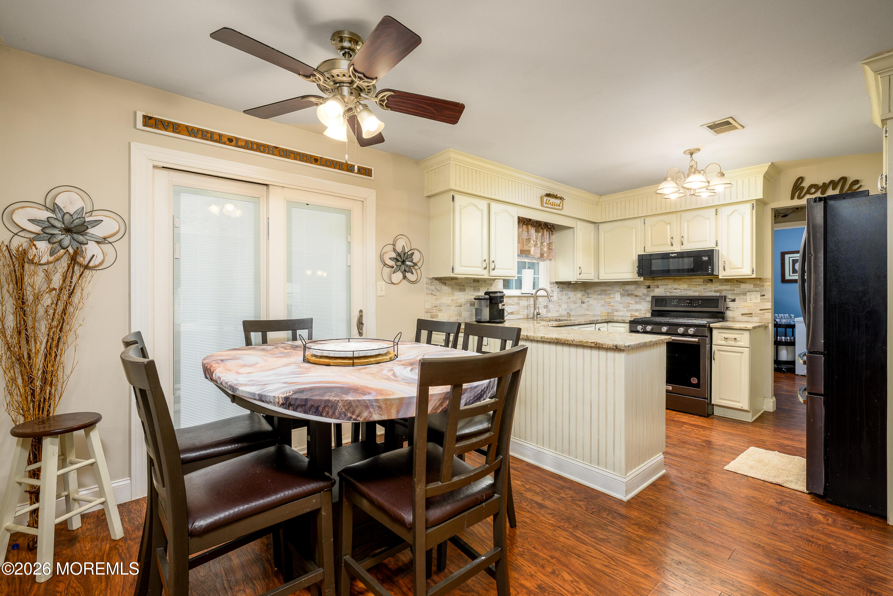 4 Cambridge Drive Howell, NJ 07731 - Photo 12 of 39 a kitchen with kitchen island a dining table and chairs