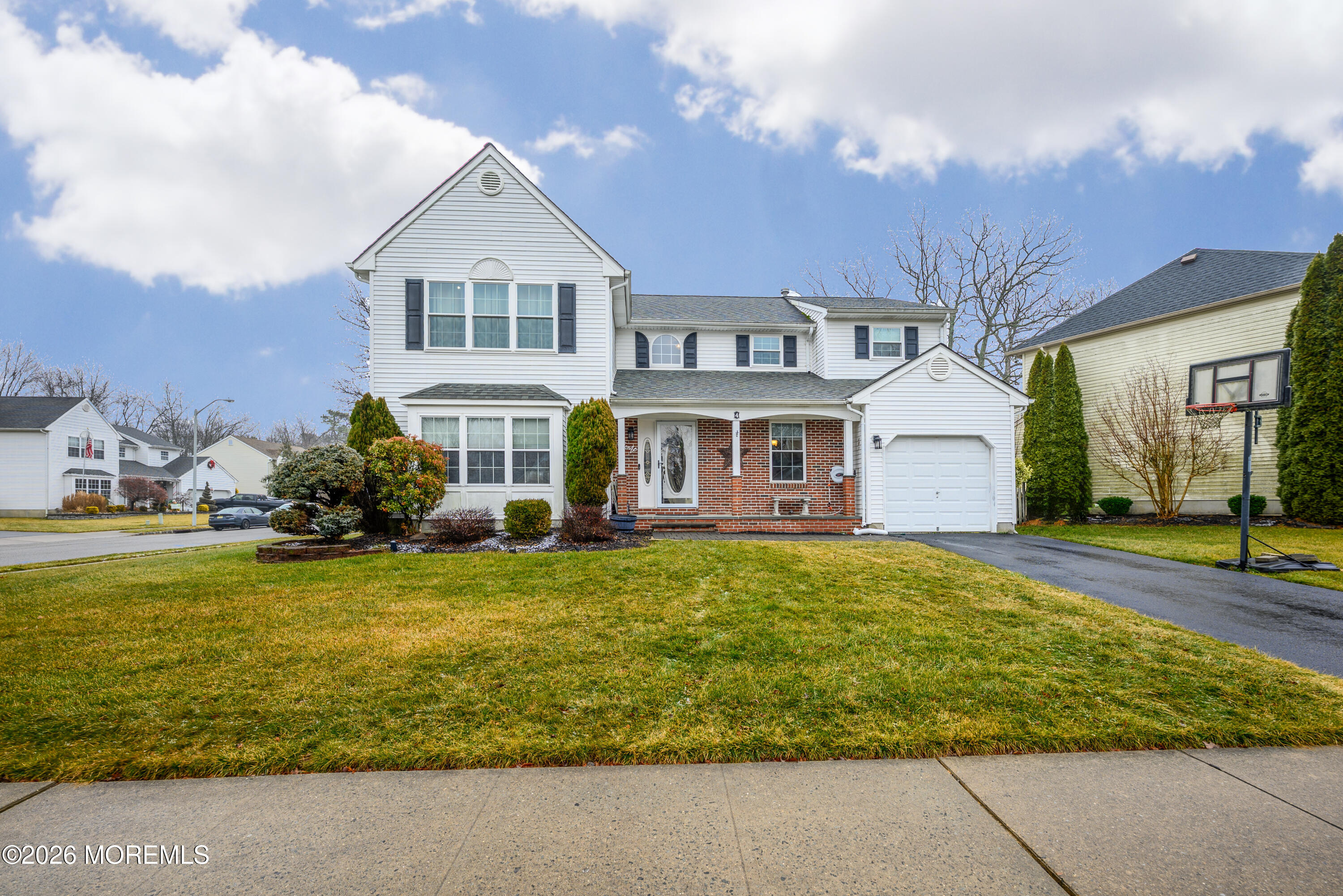 4 Cambridge Drive Howell, NJ 07731 - Photo 2 of 39 a front view of a house with swimming pool having outdoor seating