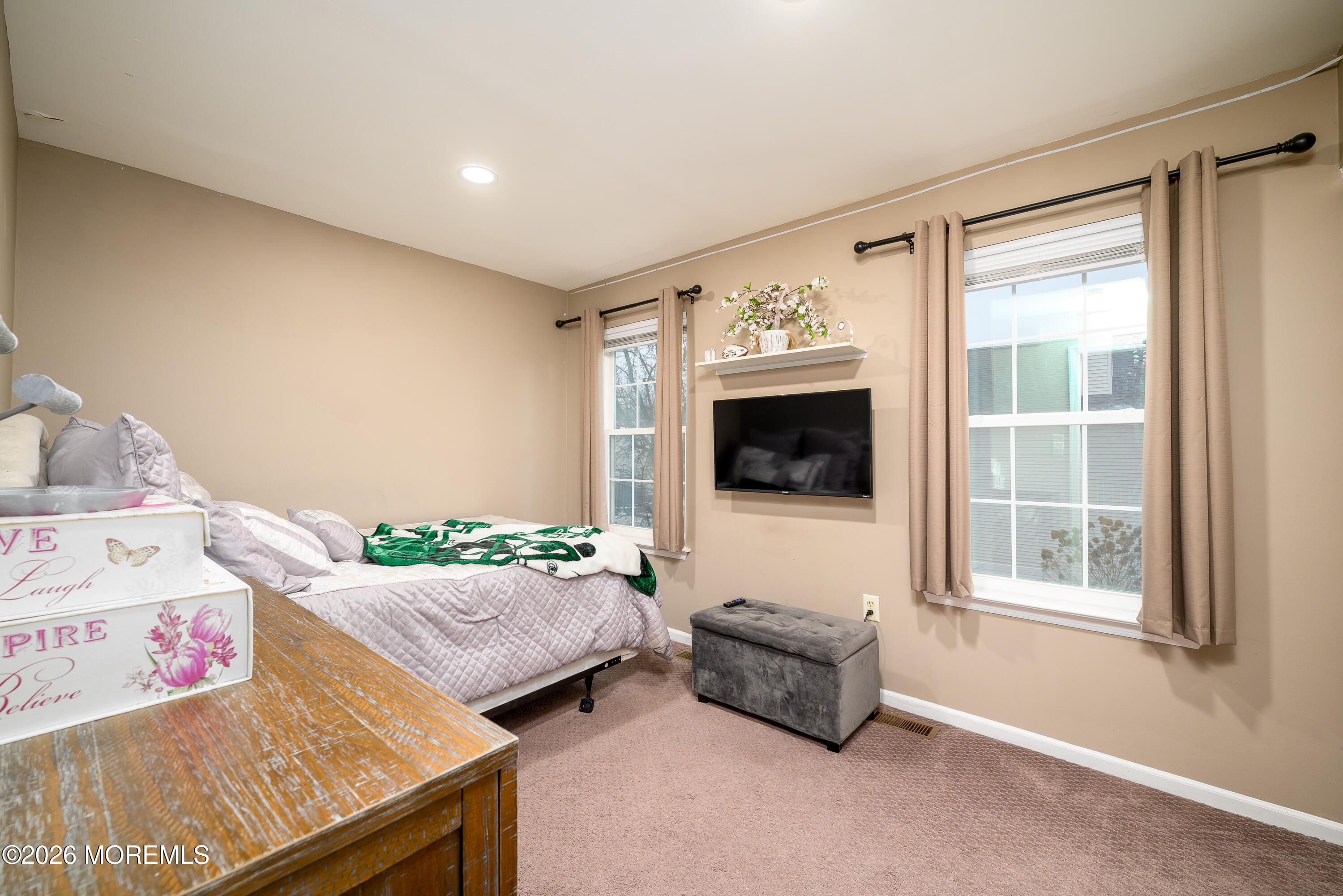 4 Cambridge Drive Howell, NJ 07731 - Photo 27 of 39 a living room with furniture and a flat screen tv