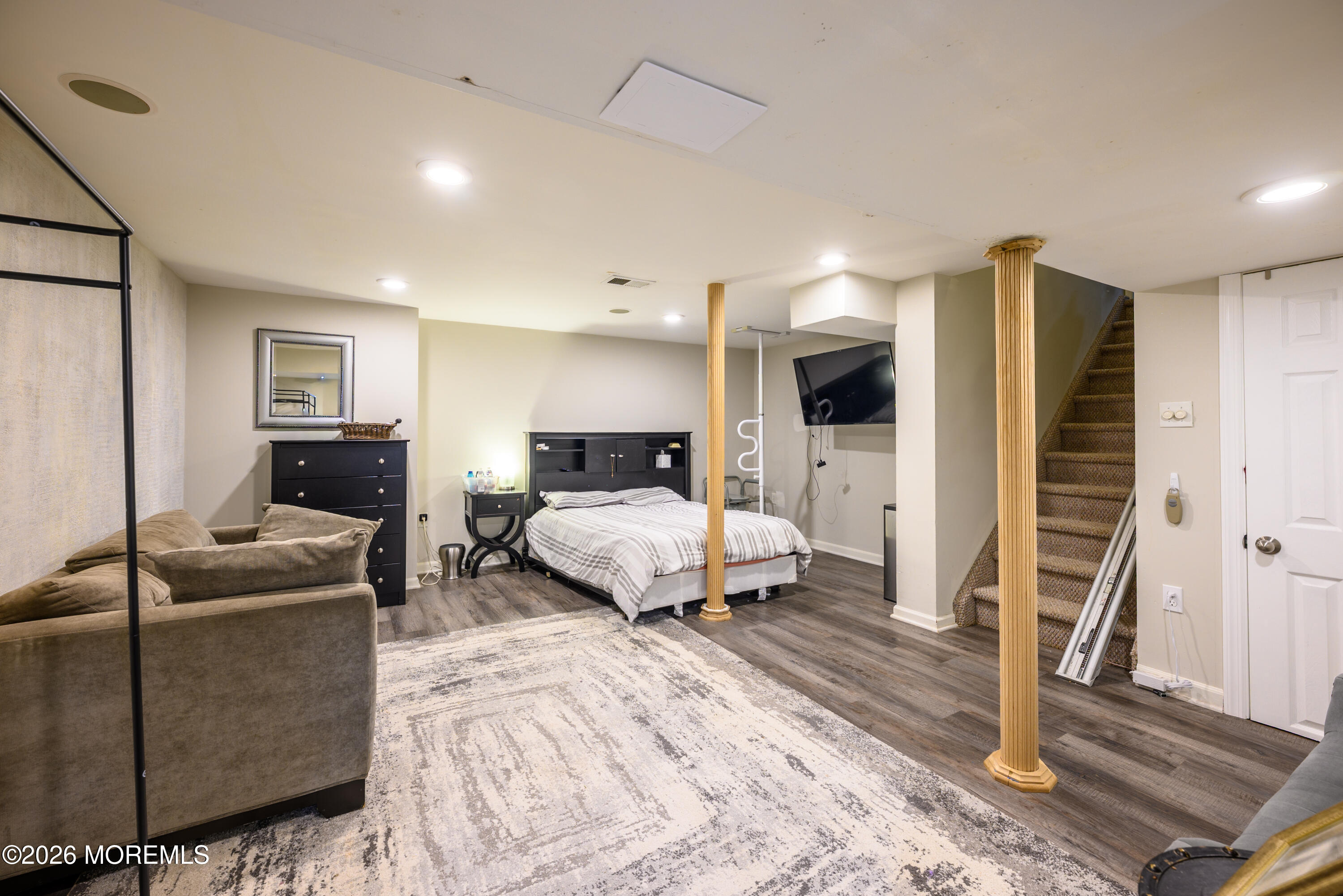 4 Cambridge Drive Howell, NJ 07731 - Photo 32 of 39 a bedroom with a large bed a couch and dresser