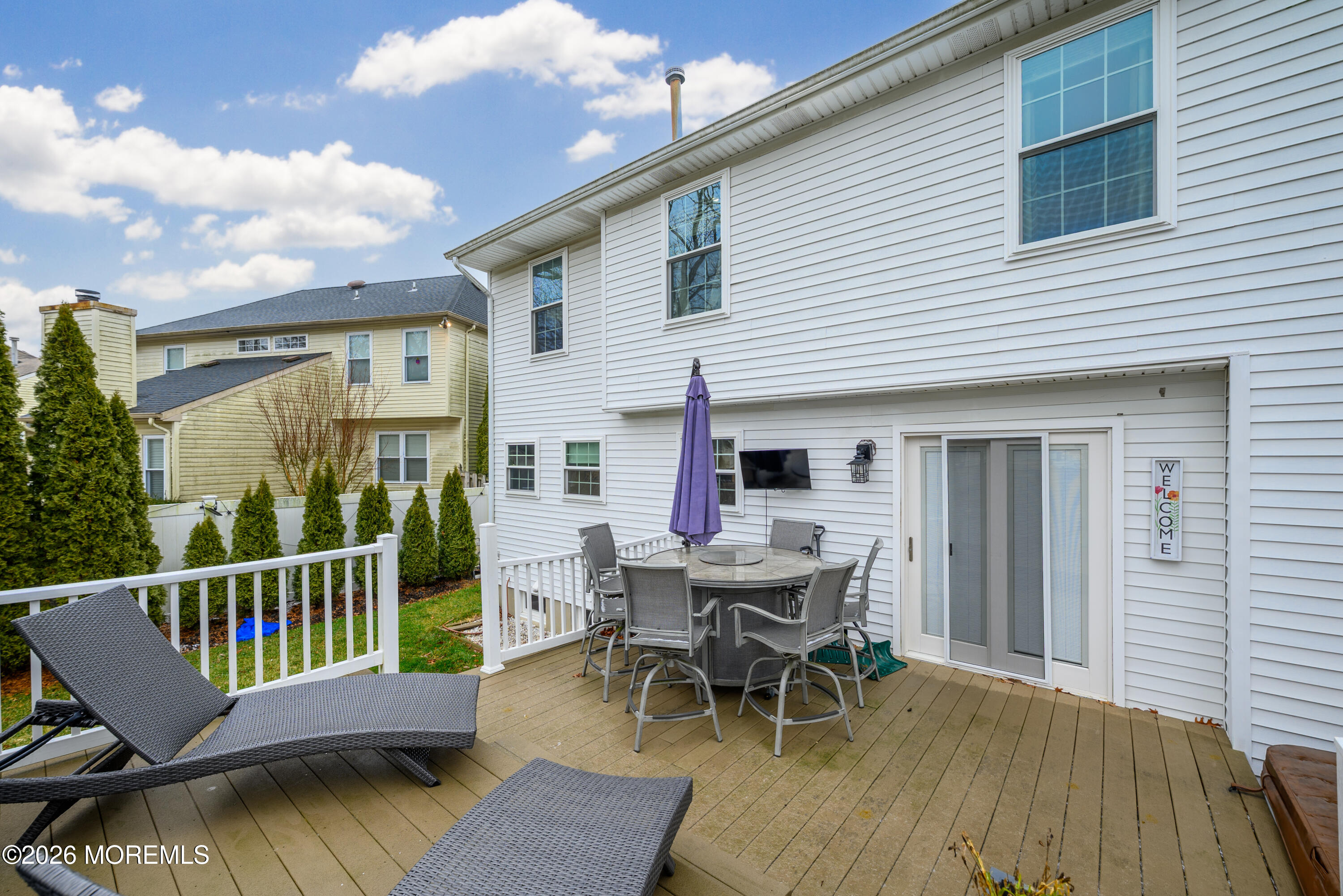 4 Cambridge Drive Howell, NJ 07731 - Photo 38 of 39 a view of a deck with a table and chairs