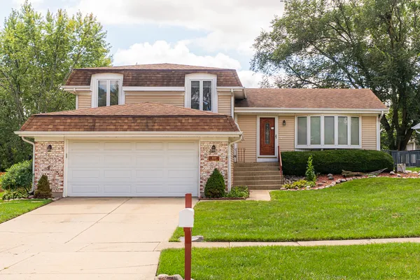 front view of a house with a yard