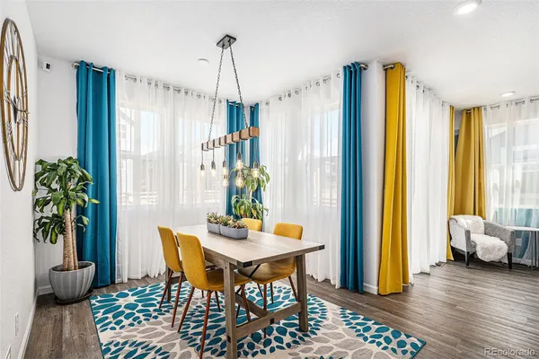 a dining room with furniture and window