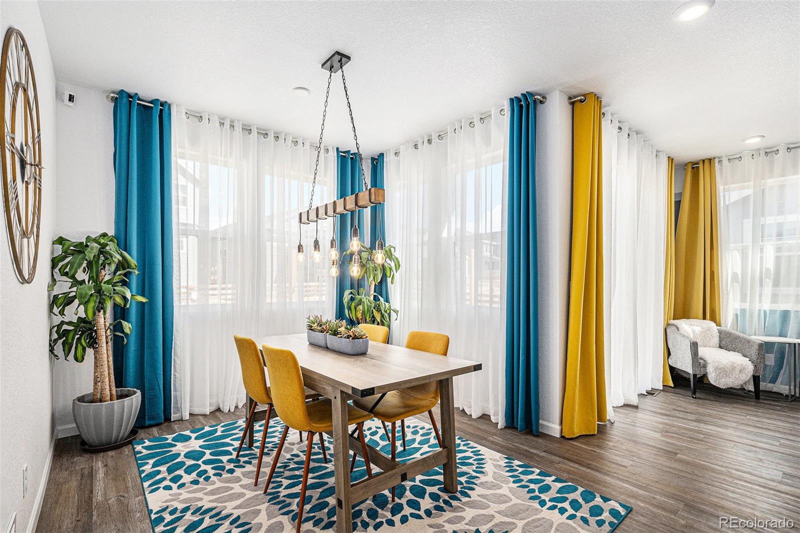 3522 North Buchanan Way Aurora, CO 80019 - Photo 13 of 30 a dining room with furniture and window