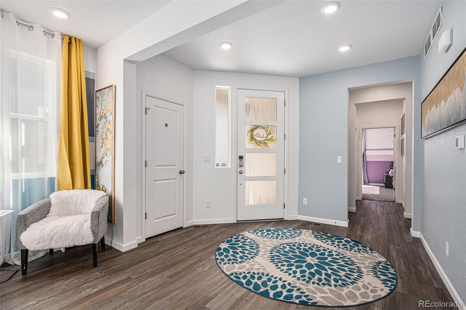 3522 North Buchanan Way Aurora, CO 80019 - Photo 2 of 30 a view of room with furniture and wooden floor