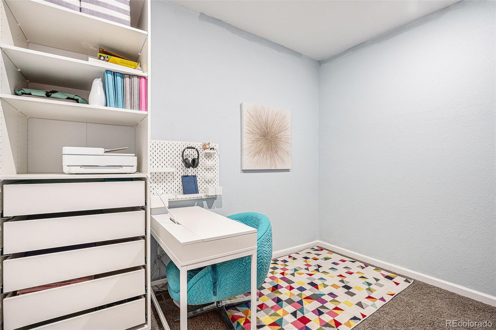 3522 North Buchanan Way Aurora, CO 80019 - Photo 21 of 30 a bedroom with a bed and a dresser