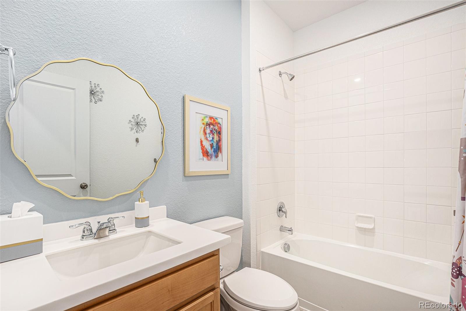 3522 North Buchanan Way Aurora, CO 80019 - Photo 23 of 30 a bathroom with a sink toilet and shower